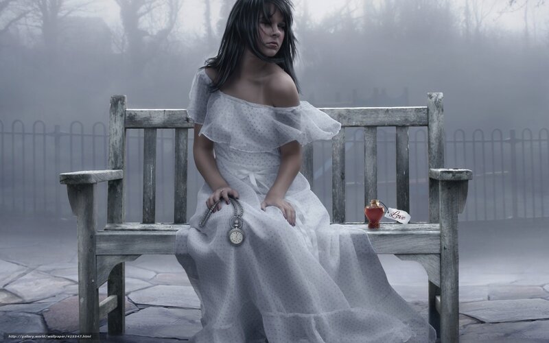 woman in white dress on bench