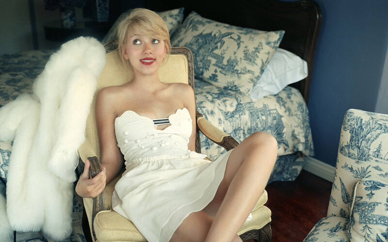 Woman in white dress on chair