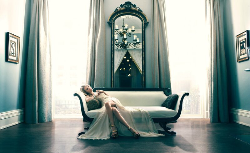 Woman in white dress on chaise lounge