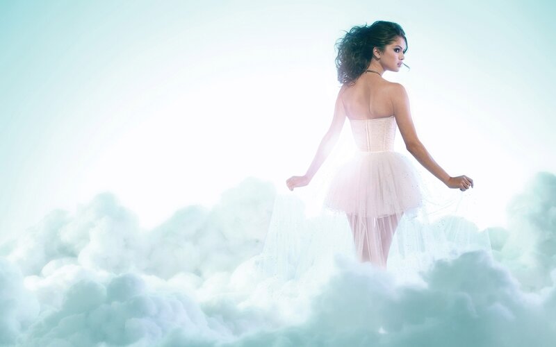 woman in white dress on clouds