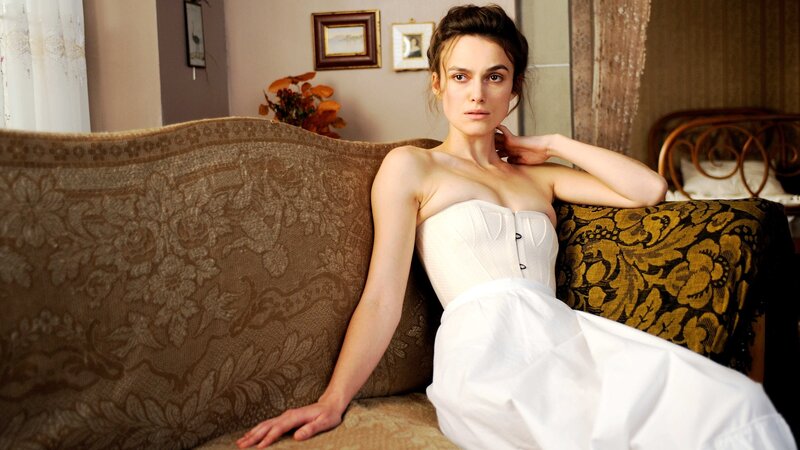 woman in white dress on couch