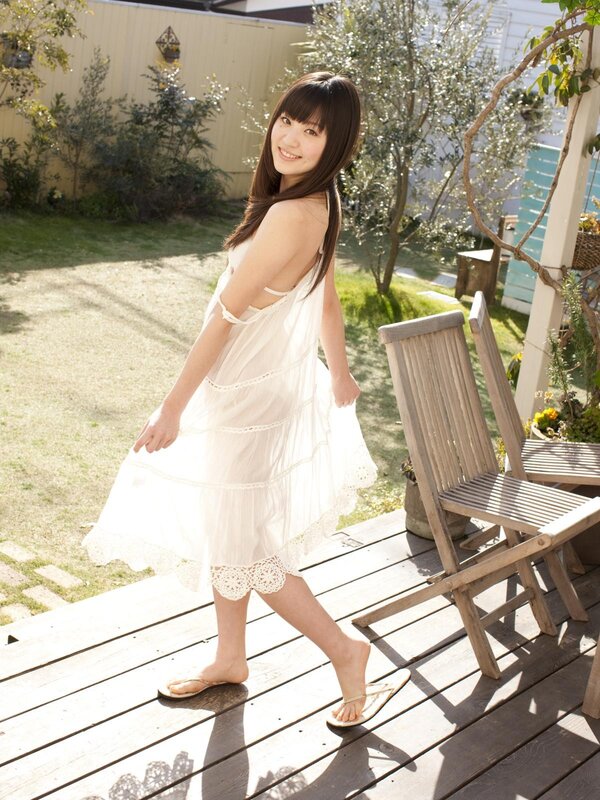 Woman in white dress on deck