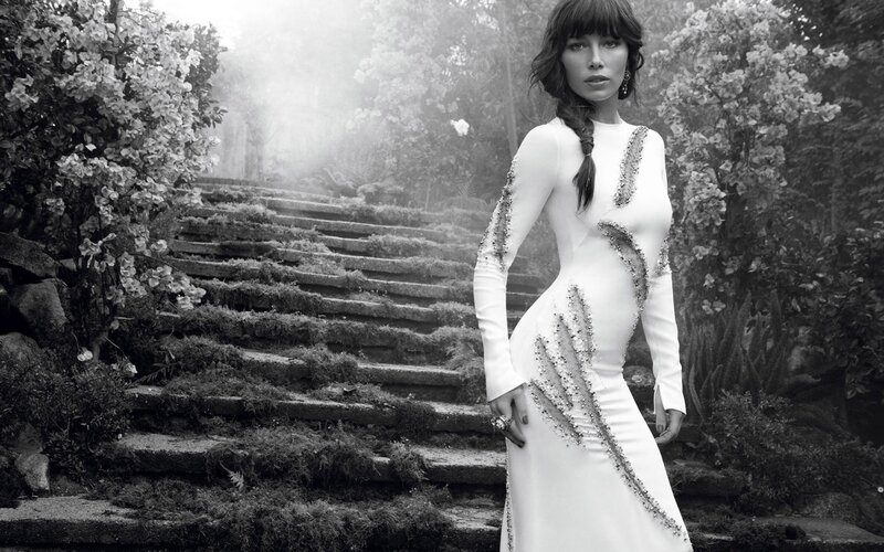 woman in white dress on garden stairs