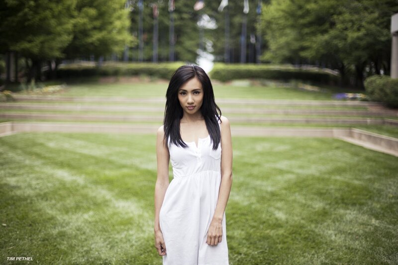 Woman in white dress on lawn