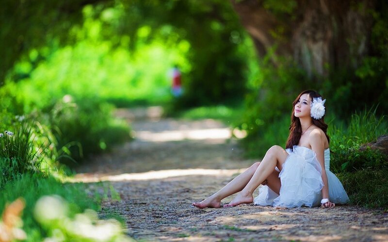 Woman in white dress on path