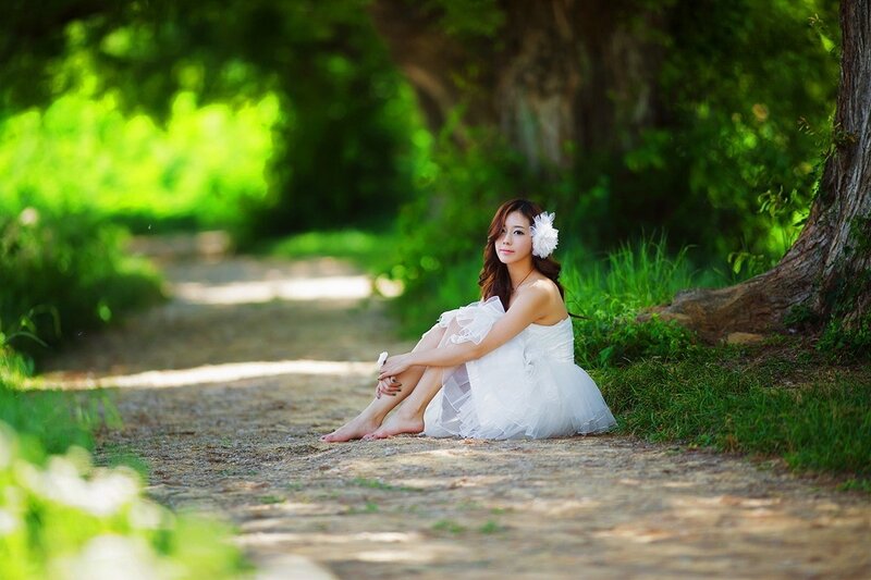 Woman in white dress on path