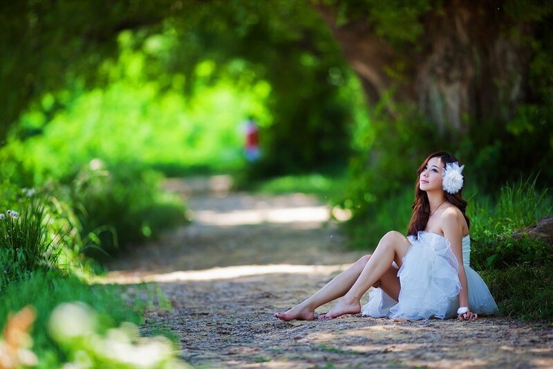 Woman in white dress on path