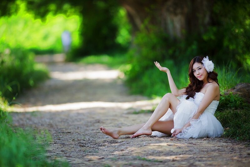 Woman in white dress on path