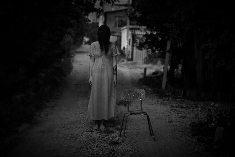 woman in white dress on path