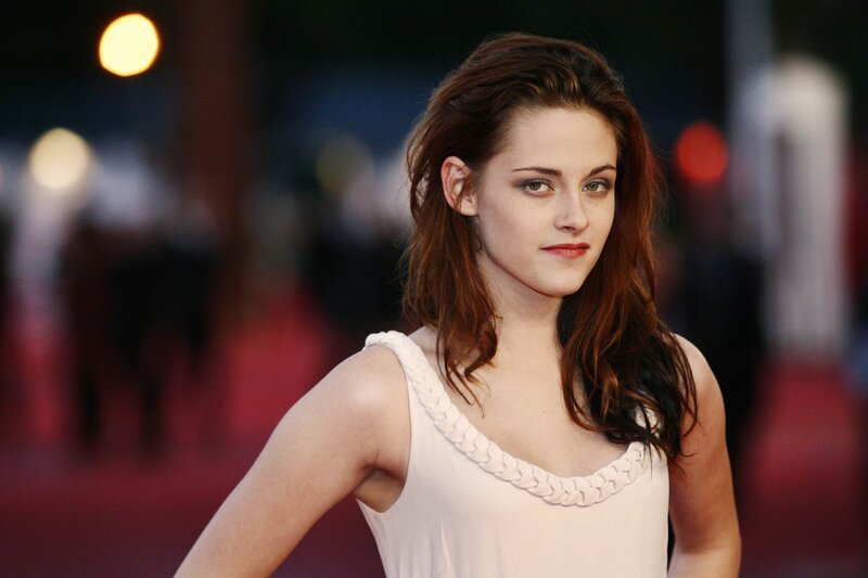 woman in white dress on red carpet