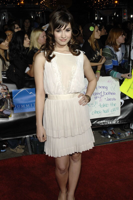 woman in white dress on red carpet