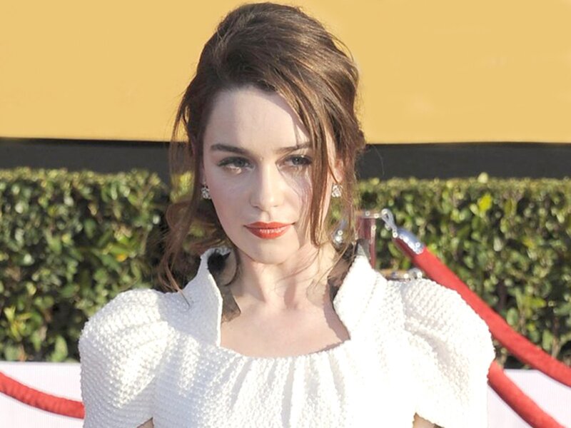 woman in white dress on red carpet