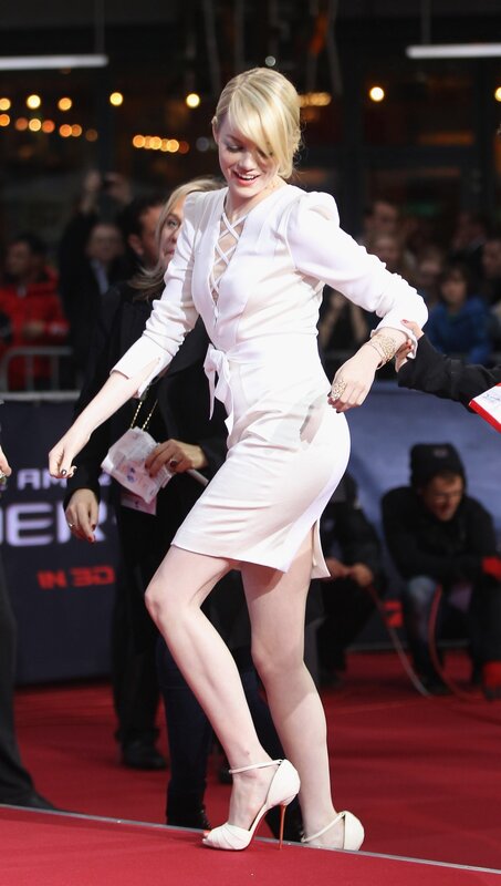 woman in white dress on red carpet