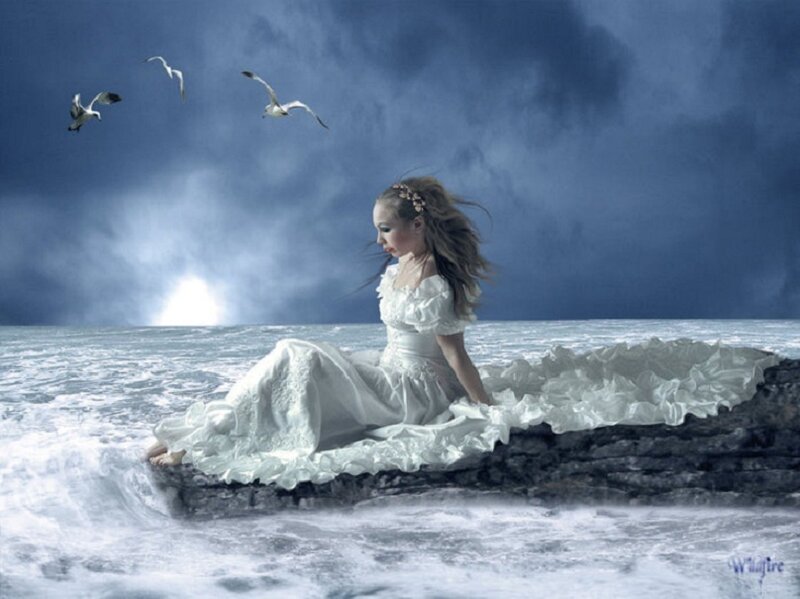 woman in white dress on rock