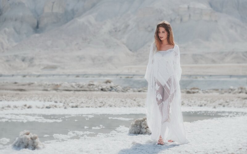 Woman in white dress on salt flats