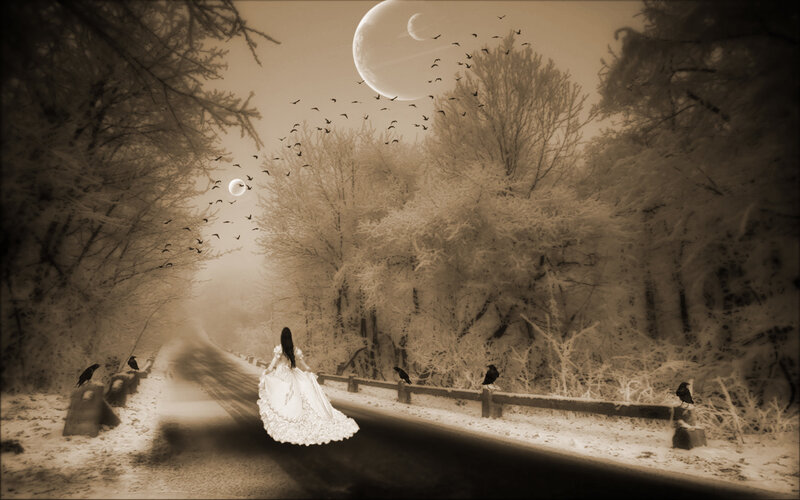 Woman in white dress on snowy road