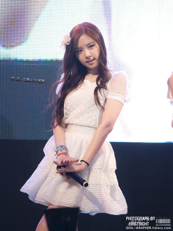 woman in white dress on stage