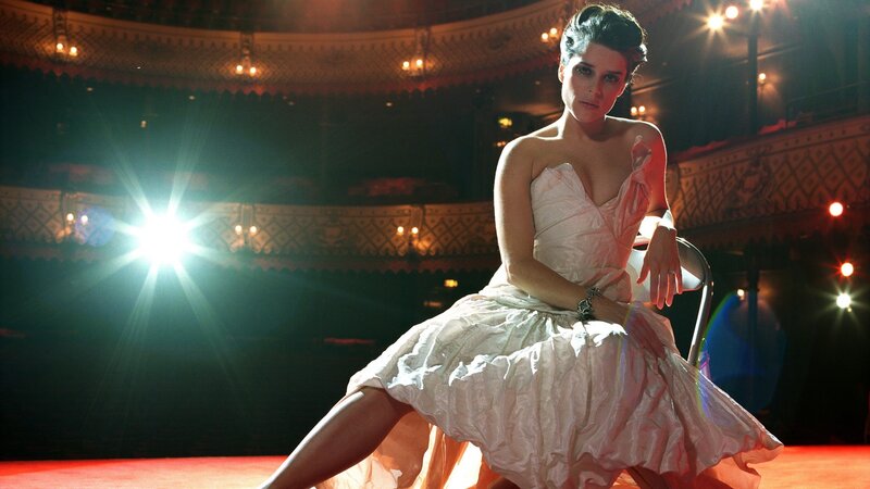 woman in white dress on stage