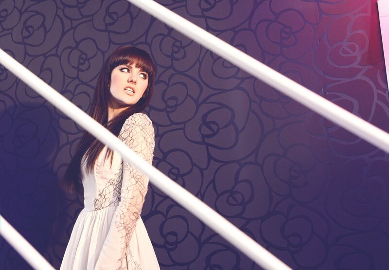 woman in white dress on stairs