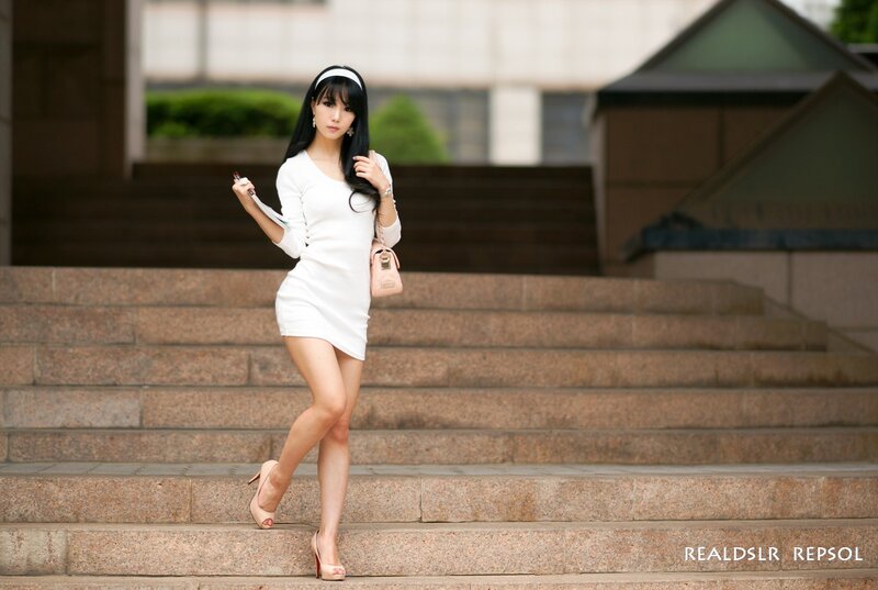 Woman in white dress on stairs