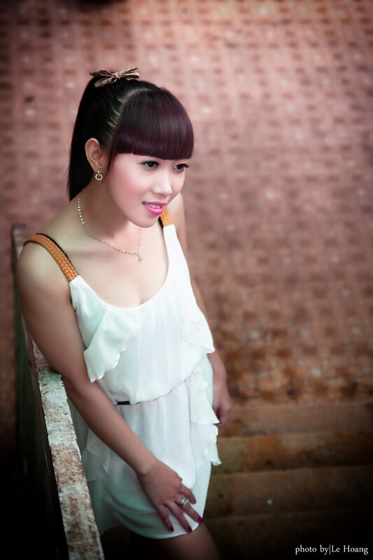 woman in white dress on stairs