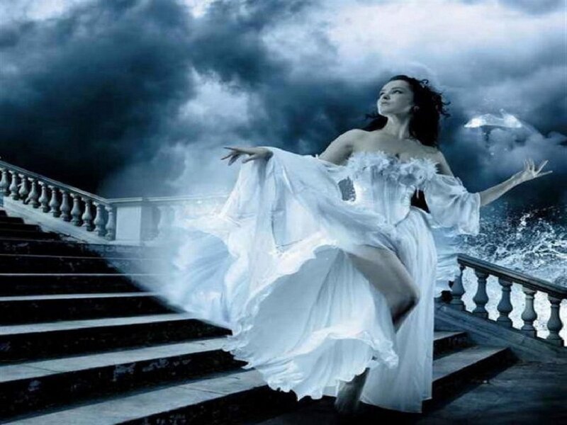 woman in white dress on stairs