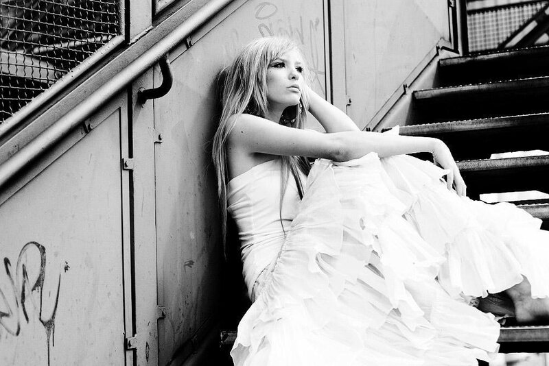 woman in white dress on stairs