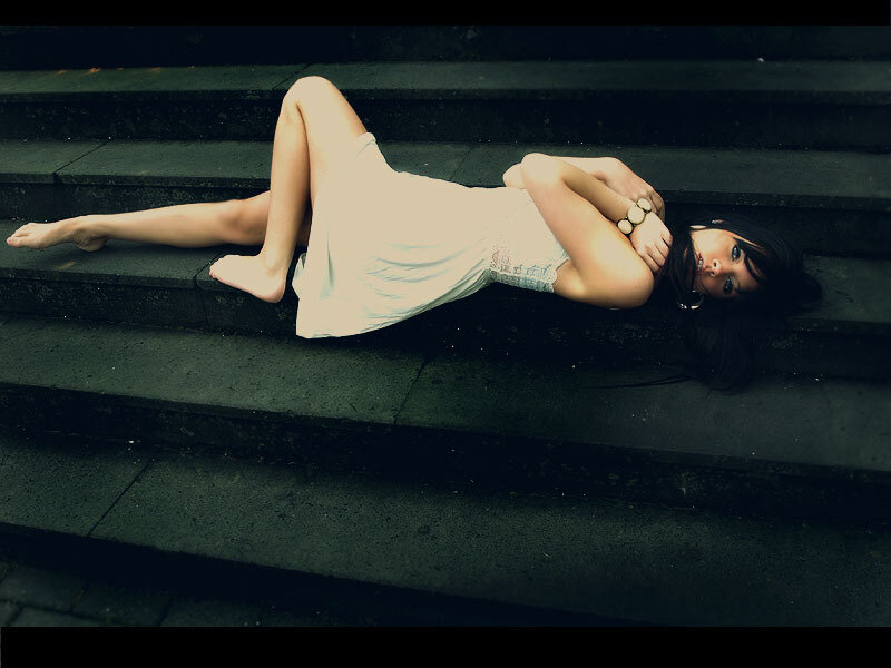 woman in white dress on stairs