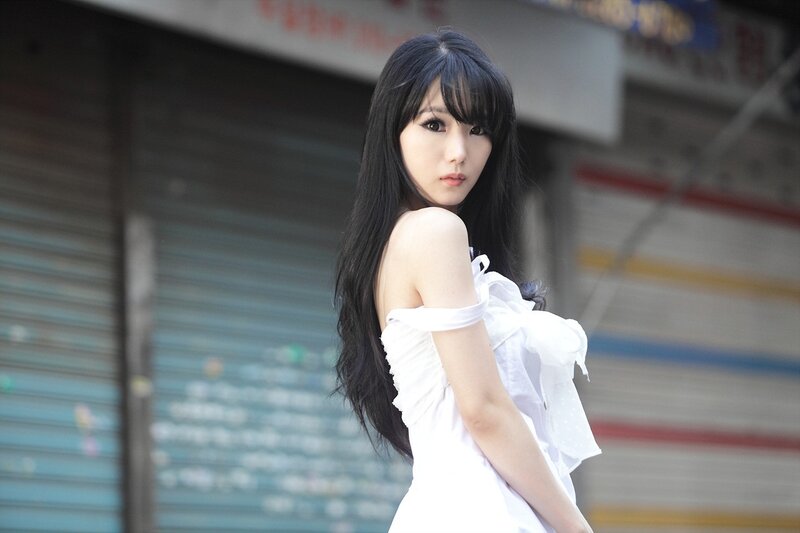 woman in white dress on street