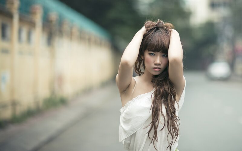 woman in white dress on street