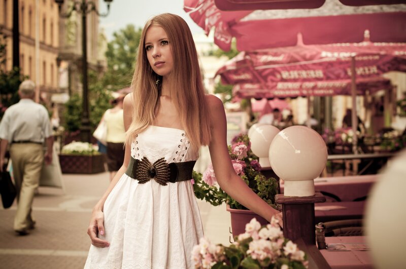 Woman in white dress on street