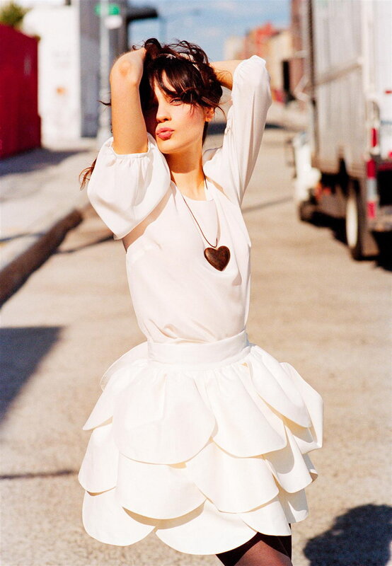 Woman in white dress on street