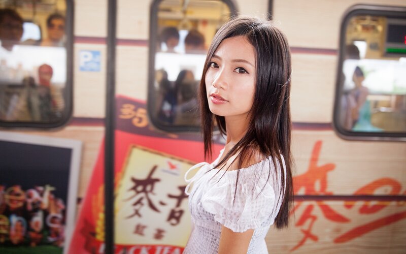 woman in white dress on train