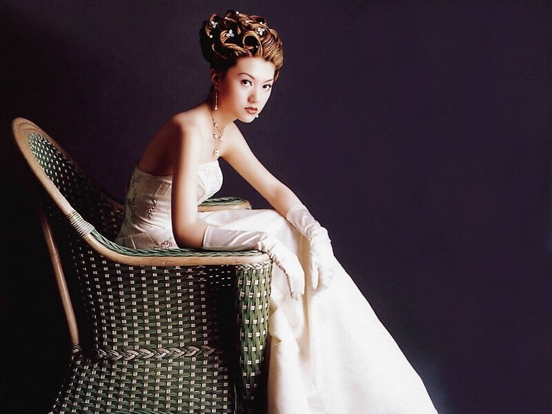 woman in white dress on wicker chair