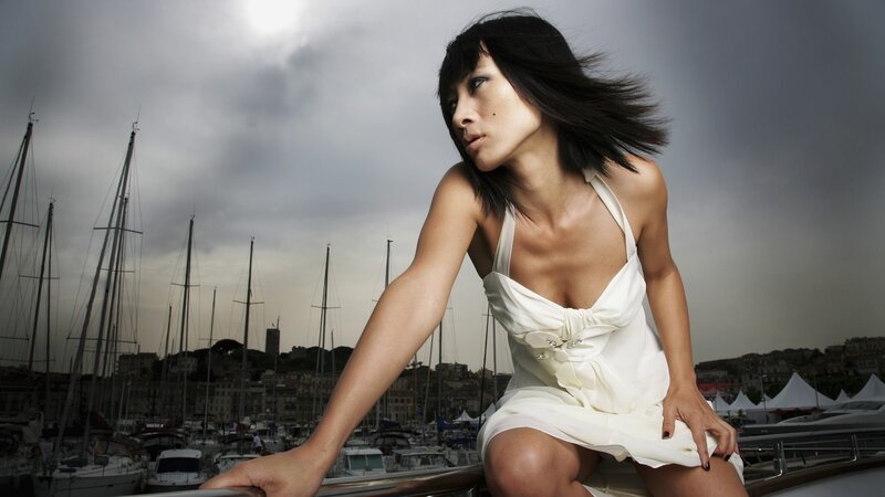 Woman in white dress on yacht