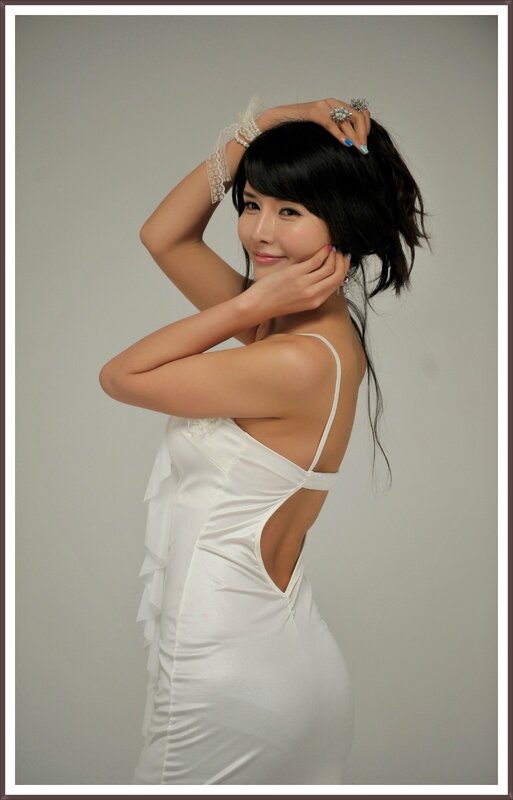 woman in white dress posing