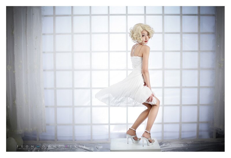 woman in white dress posing