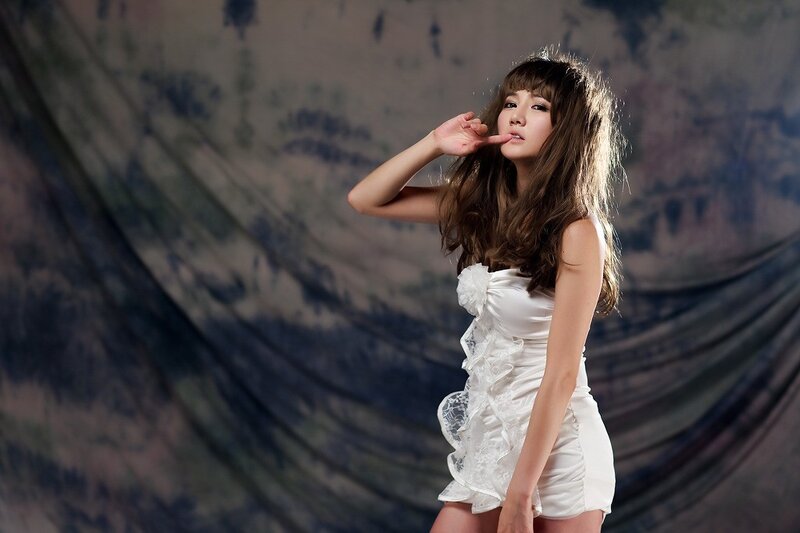 woman in white dress posing