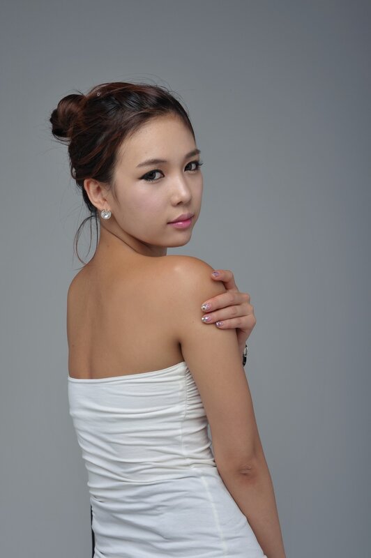 woman in white dress posing