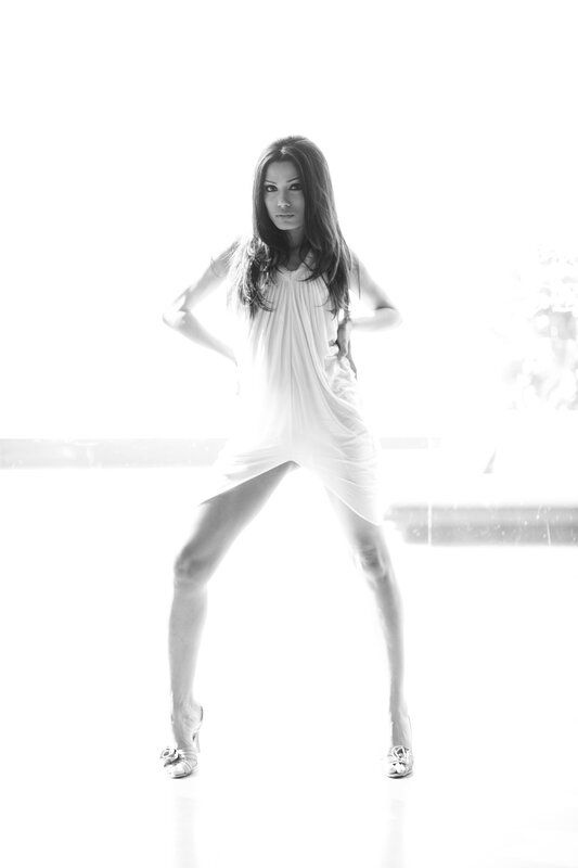 woman in white dress posing