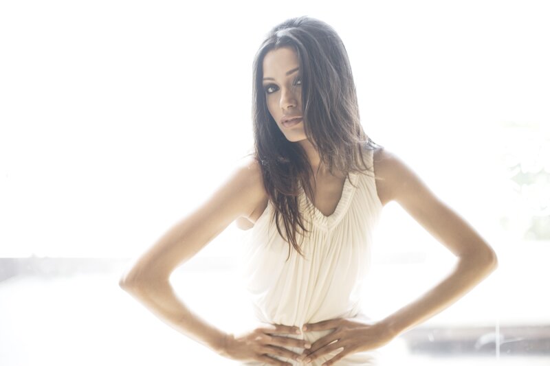 woman in white dress posing