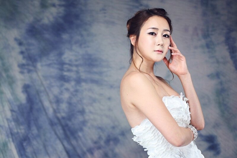 woman in white dress posing