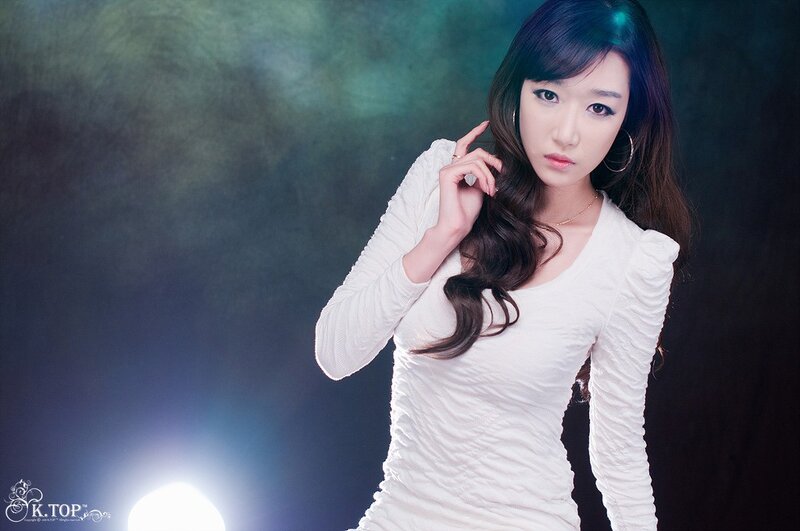 woman in white dress posing