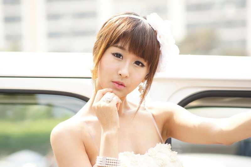 woman in white dress posing