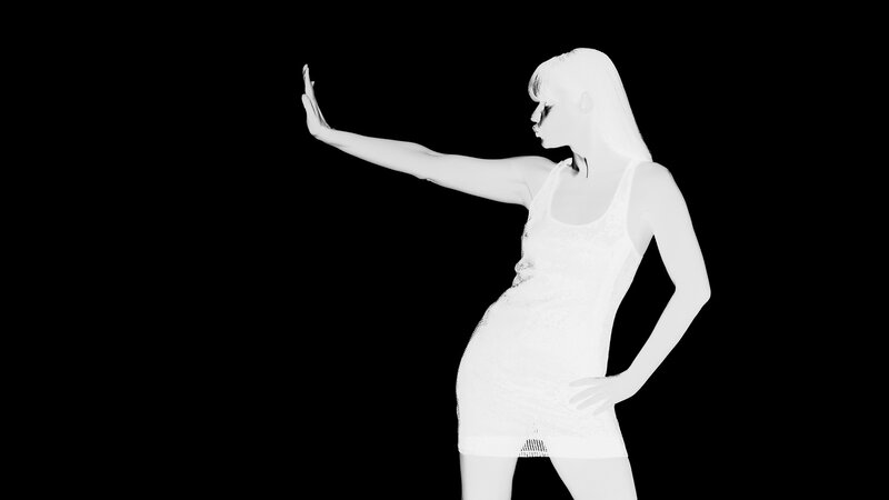 woman in white dress posing