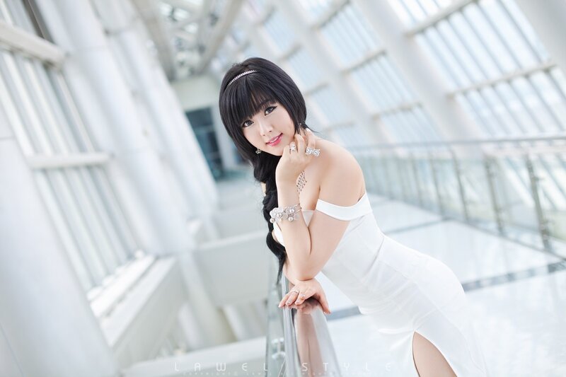woman in white dress posing