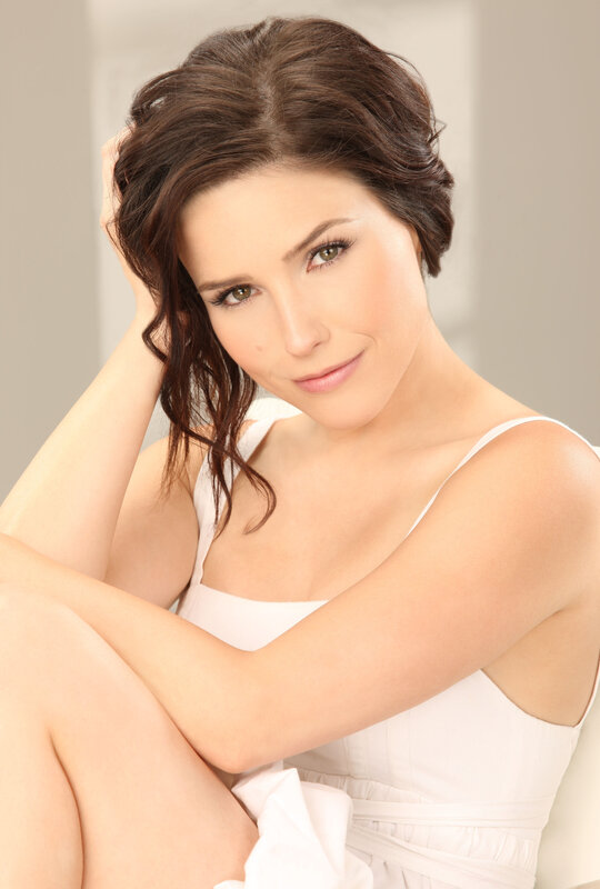 woman in white dress posing