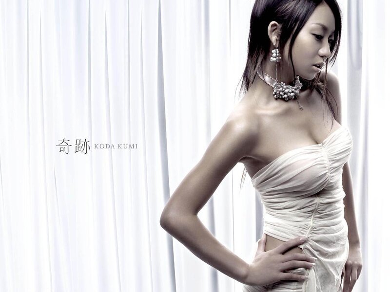 woman in white dress posing