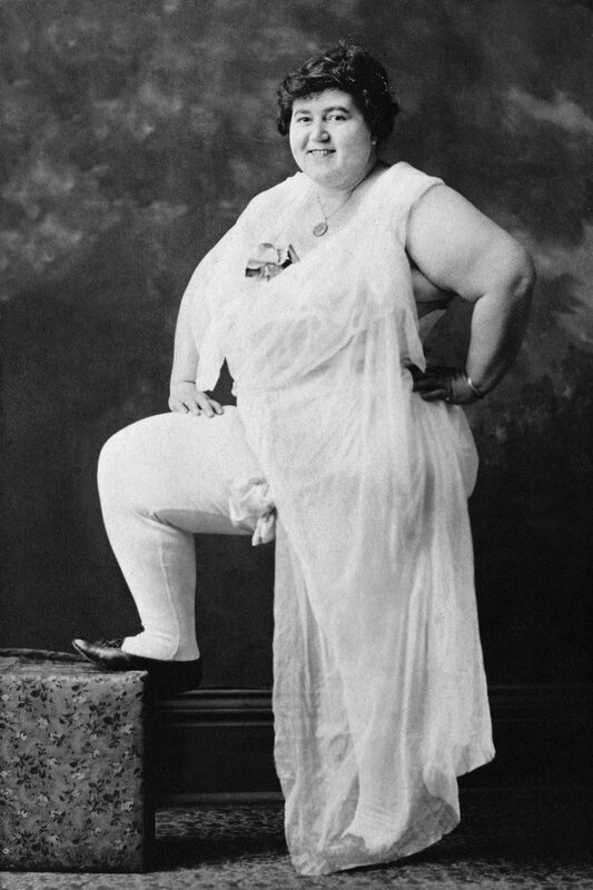 Woman in white dress posing