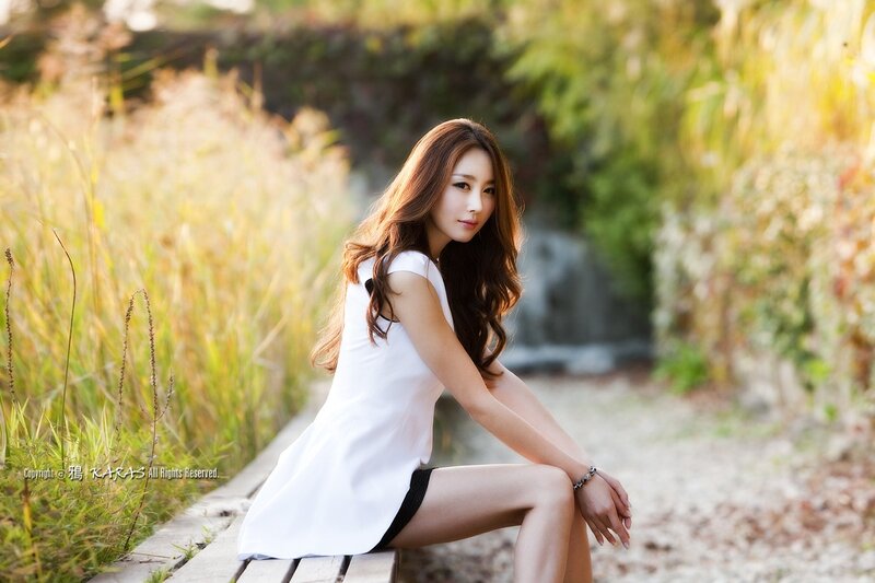 Woman in White Dress — Serene, Afternoon, Photograph, Bench, Grass